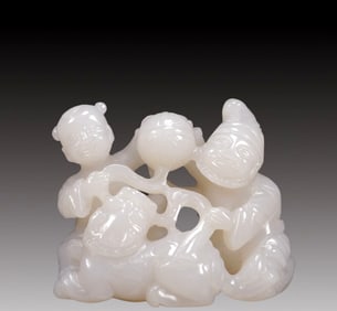 An Exquisite White Jade Figure and Lion Ornament