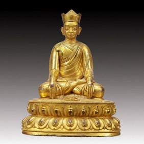 A Solemn Gilt Bronze Statue of Guru