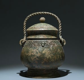 An Archaic Bronze Cloud Thunder Pattern Ewer