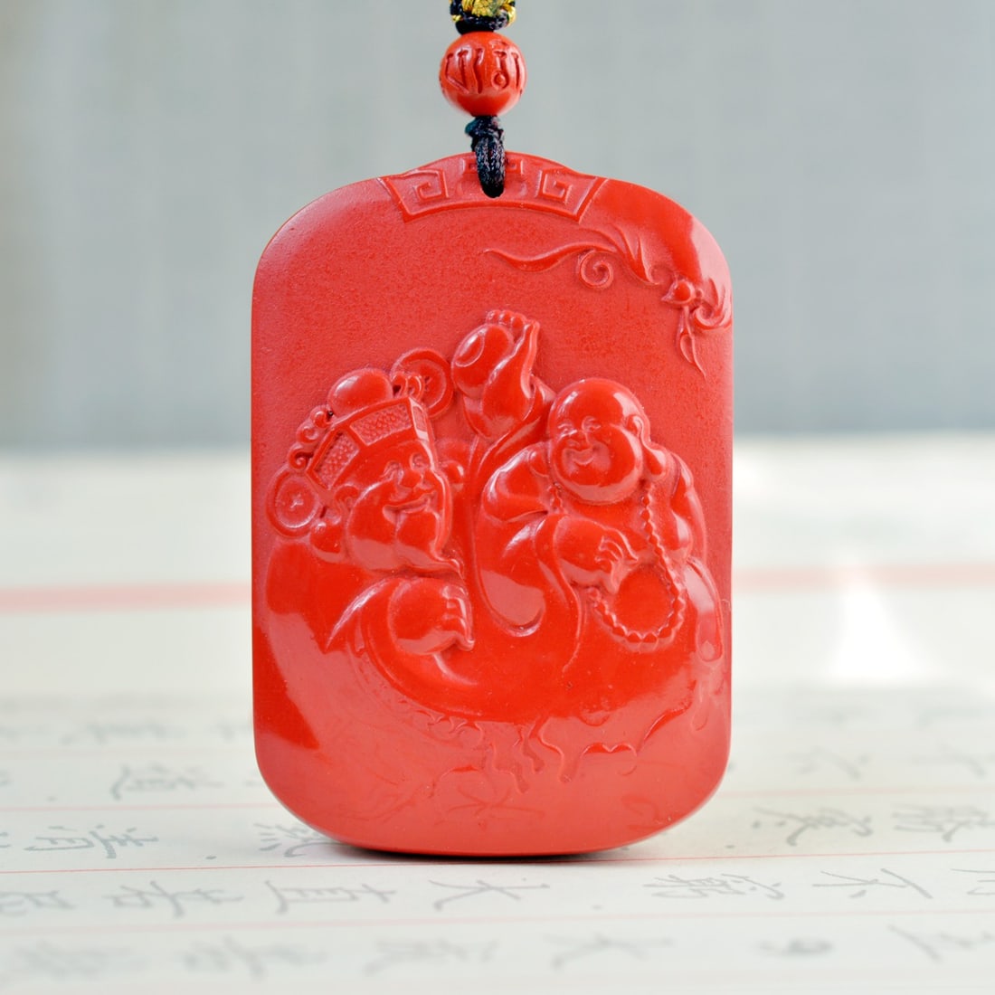 An Exquisite Cinnabar Buddha Pattern Pendant: An Exquisite Cinnabar Buddha Pattern Pendant,Size:36mmx53mm (???)?????????????????????????????????????????? ???????