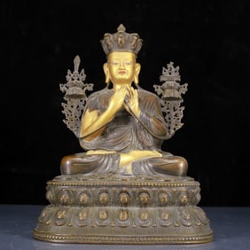 A Solemn Gilt Bronze Statue of Guru