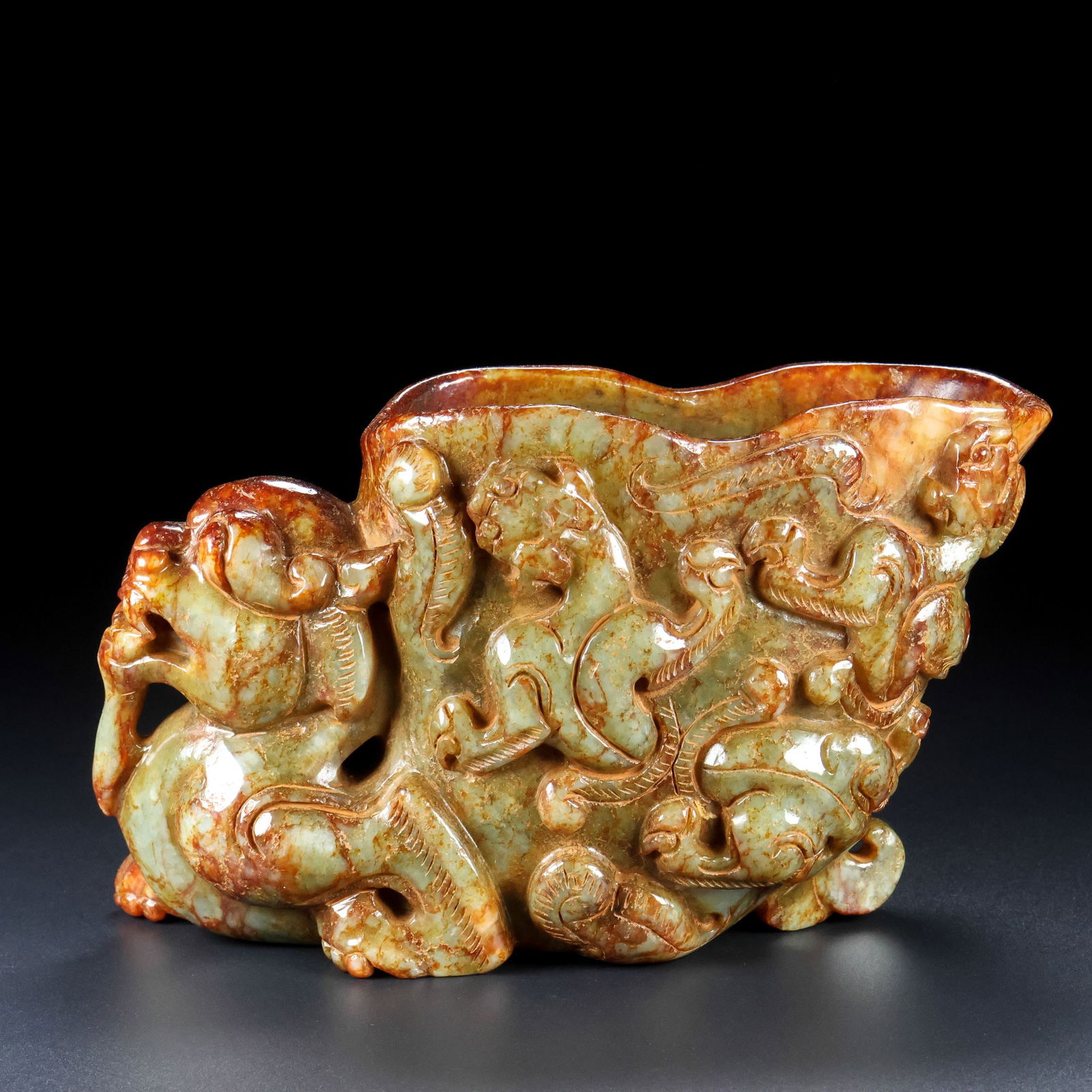 An Exquisite Archaic Jade Auspicious Beast Goblet (1 of 8)