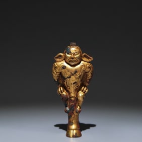 A Rare Gilt Bronze Figure-Face Ornament