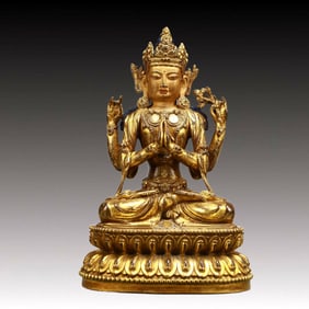 A Solemn Gilt Bronze Statue of Four-arms Guanyin