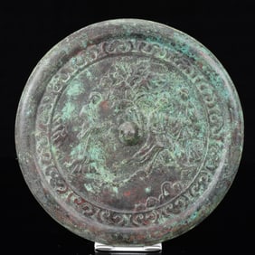 An Archaic Bronze Landscape Pattern Round Mirror