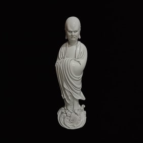 A Solemn Blance-De-Chine Statue of Dharma