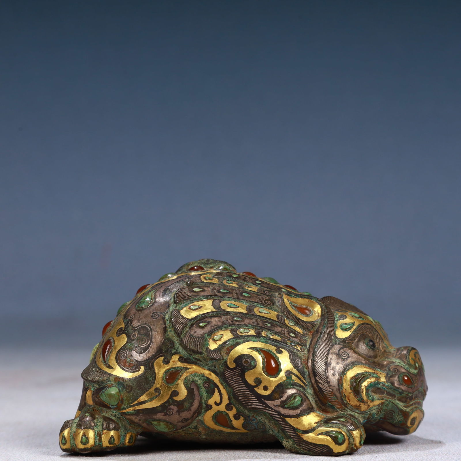 An Archaic Bronze Inlaid Gold and Silver Auspicious Beast Ornament,Inlaid Gems: An Archaic Bronze Inlaid Gold and Silver Auspicious Beast Ornament,Inlaid Gems,Qing Dynasty, China,Size:3.9inx2.4inx2in,Weight:450g 青铜错金银瑞兽摆