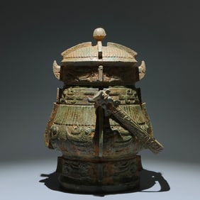 An Archaic Bronze Phoenix Pattern Loop-handled Pot