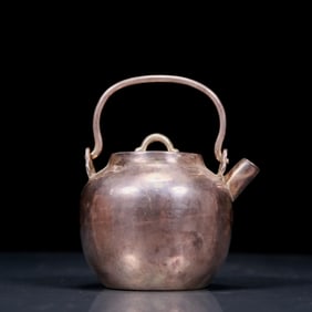 An Exquisite Silver Teapot