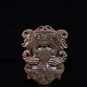 A Rare Gaogu yu Beast-Face Pendant
