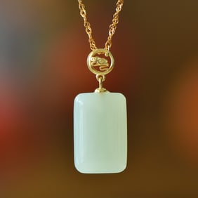 An Exquisite Sterling Silver-Gold Plated Inlaid White Jade Pendant