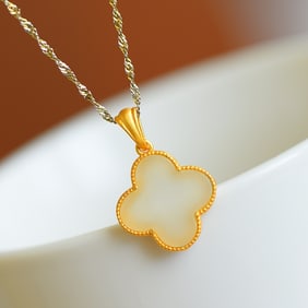An Exquisite Sterling Silver-Gold Plated Inlaid White Jade Pendant