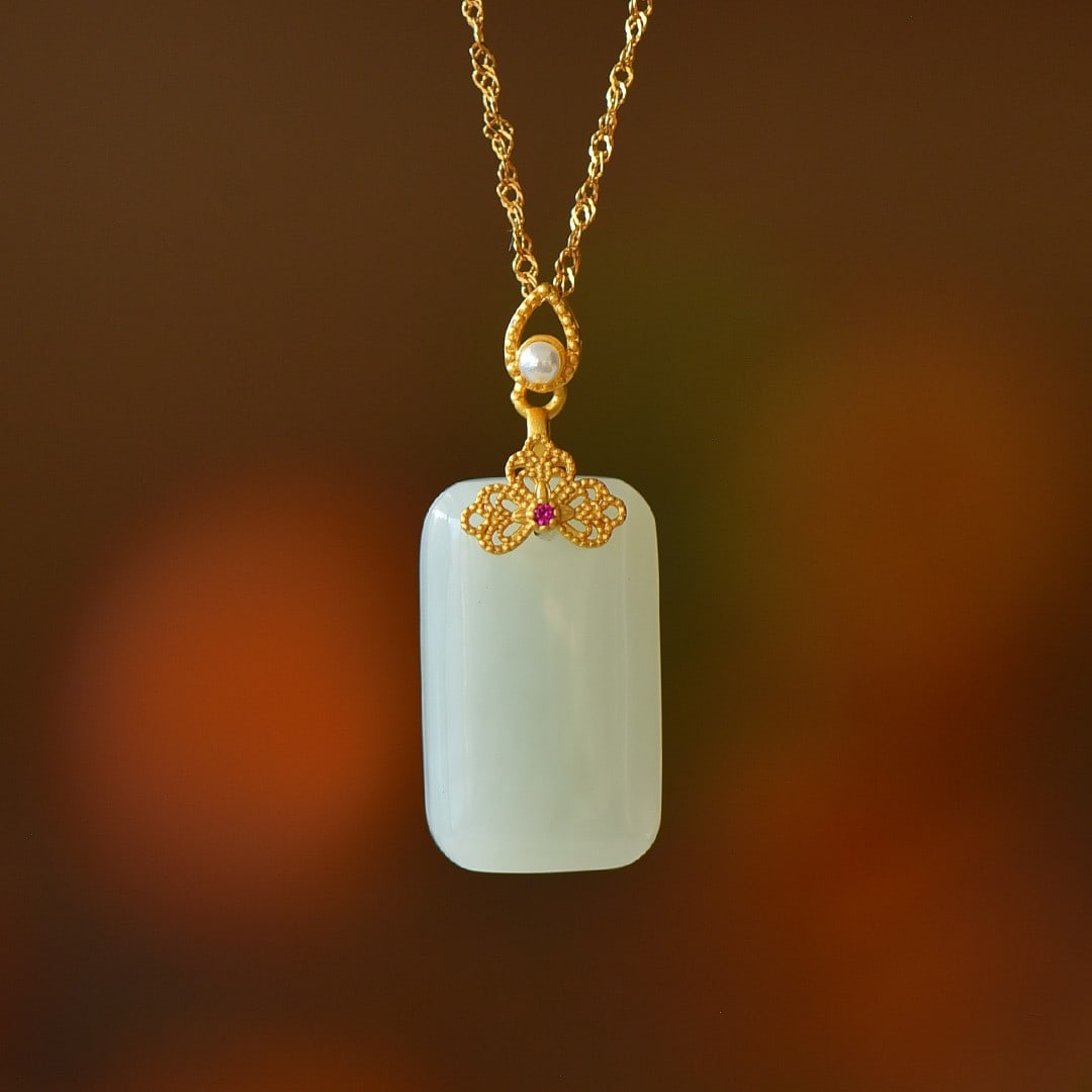 An Exquisite Sterling Silver-Gold Plated Inlaid White Jade Pendant: An Exquisite Sterling Silver-Gold Plated Inlaid White Jade Pendant,Size:0.6inx0.9in 纯银镀金镶白玉吊坠