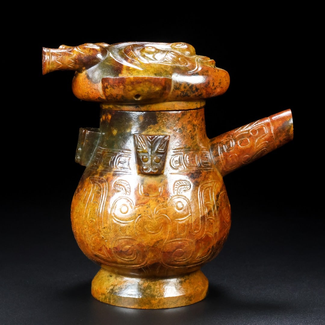 An Exquisite White Jade Beast-Face Pattern Ewer: An Exquisite White Jade Beast-Face Pattern Ewer Han Dynasty, China Size:5.5inx5.1inx3.3in Weight:870g白玉兽面玉壶 中国汉代