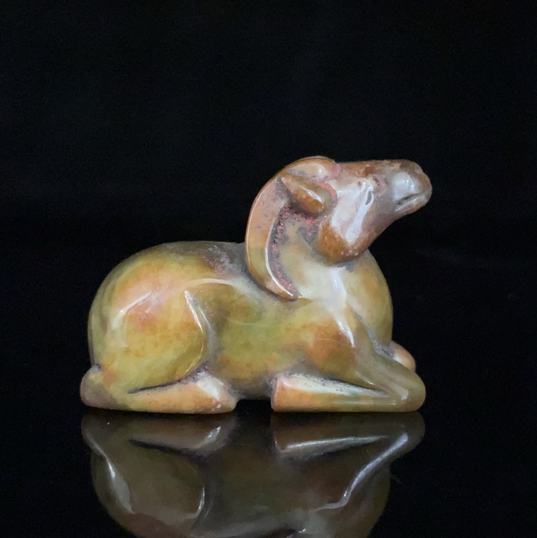 An Exquisite White Jade Sheep Ornament: An Exquisite White Jade Sheep Ornament Qing Dynasty, China Size:2.2inx1inx1.6in Weight:90g白玉羊 中国清代 Size:5.7cmx2.6cmx4.1cm Weight:90g