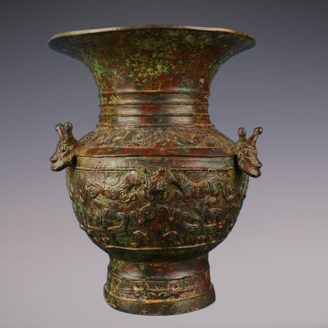 An Exquisite Bronze Auspicious Beast Pattern Vase: An Exquisite Bronze Auspicious Beast Pattern Vase W.Zhou , China Size:6.7inx8.3in Weight:1700g青铜龙虎尊 西周时期 Size:17cmx21cm Weight:1700g