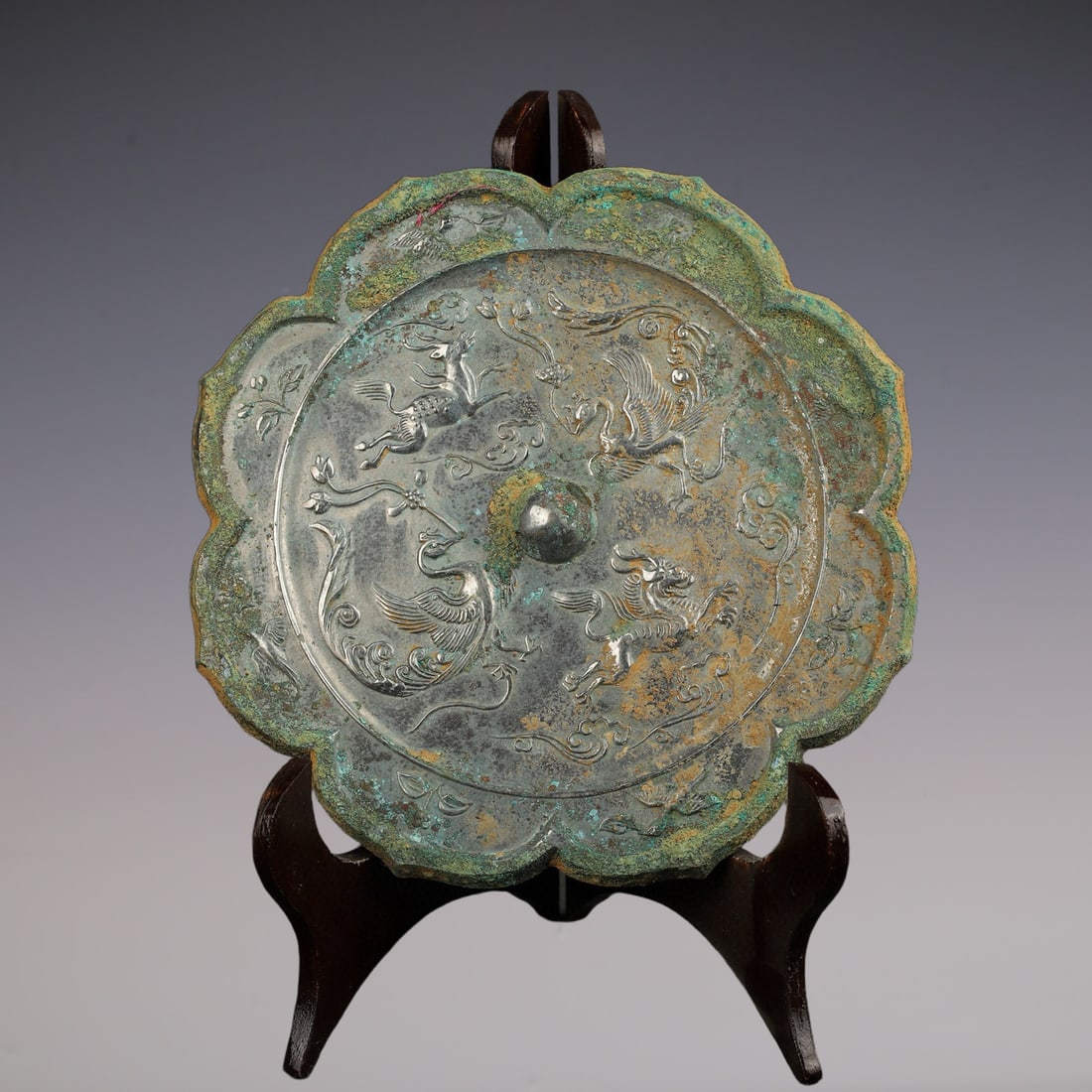 An Exquisite Bronze Auspicious Beast Pattern Round Mirror: An Exquisite Bronze Auspicious Beast Pattern Round Mirror Tang Dynasty, China Size:8inx0.3in Weight:920g青铜兽纹镜 中国唐代 Size:20.2cmx0.8cm Weig
