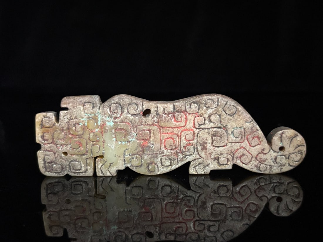 An Exquisite White Jade Dragon Pattern Tiger-Shaped Ornament: An Exquisite White Jade Dragon Pattern Tiger-Shaped Ornament Han Dynasty, China Size:4.3inx1.3inx0.4in Weight:67g白玉龙纹玉虎 中国汉代 Size: