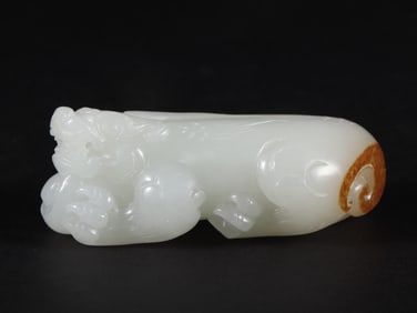 An Exquisite White Jade Auspicious Beast Hand Piece
