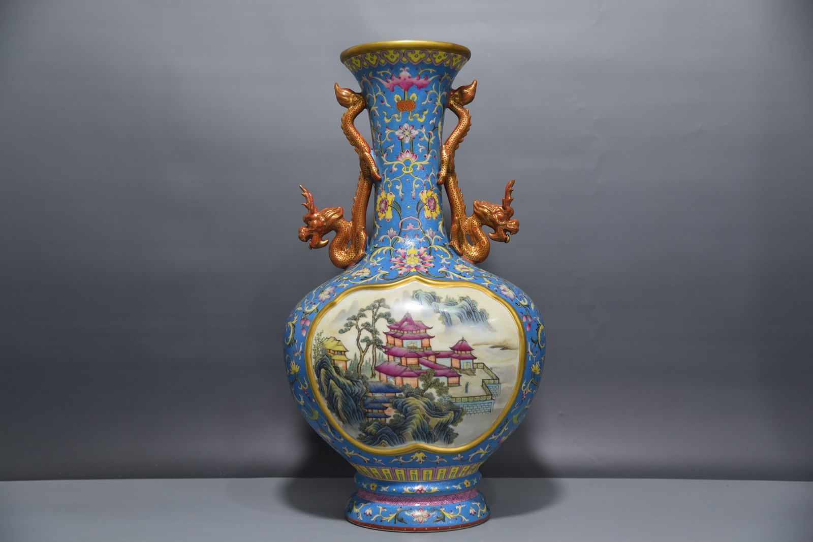 A Exquisite Blue Ground Famille-Rose Painted Gold Landscape Pattern Vase: A Exquisite Blue Ground Famille-Rose Painted Gold Landscape Pattern Vase,Qing Dynasty, China,Qianlong Four-character Mark,Size:19.7inx5.4inx10.6inx8.3in 