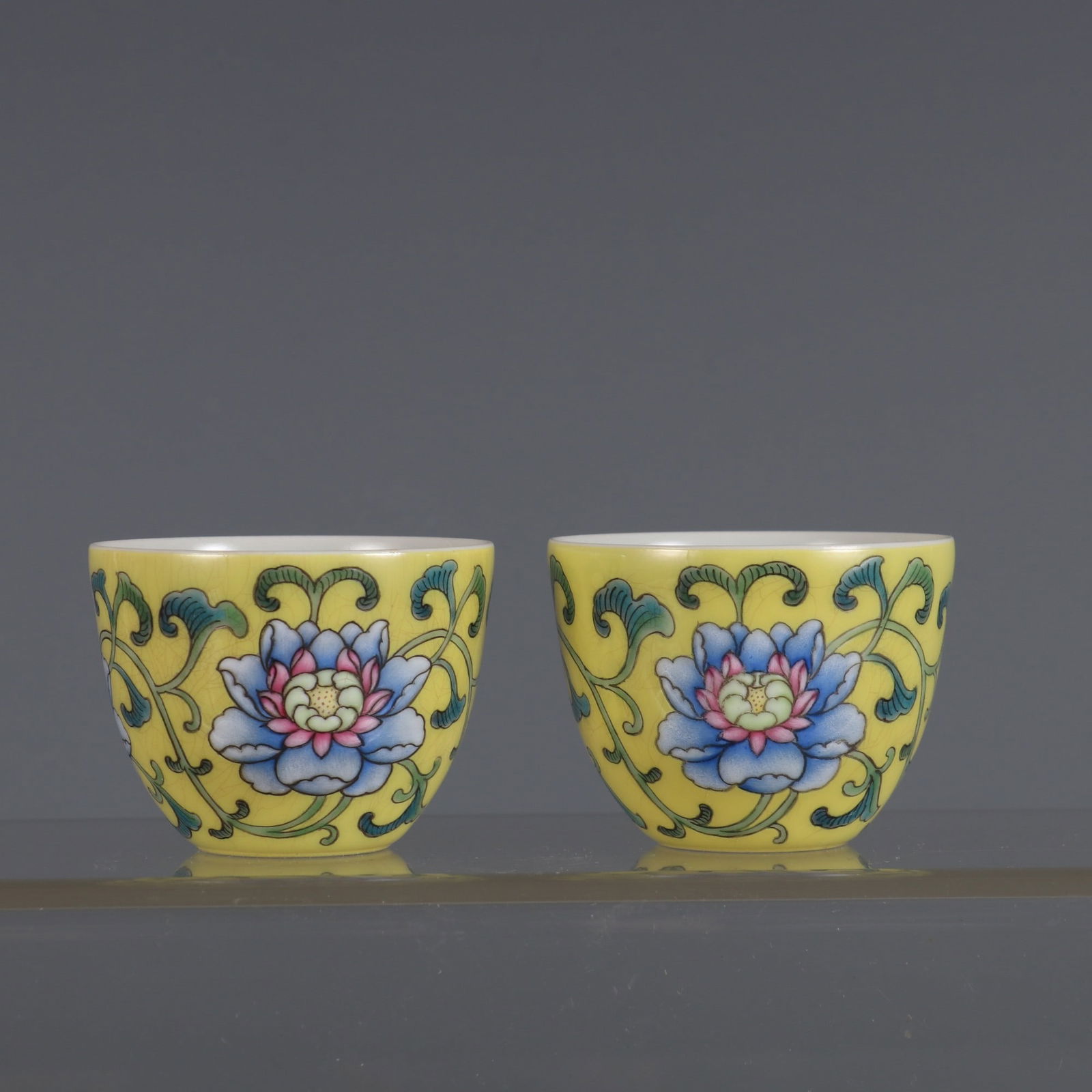 A Pair of Rare Yellow Ground Enameled Passion Flower Pattern Bowl Cups: A Pair of Rare Yellow Ground Enameled Passion Flower Pattern Bowl Cups,Qing Dynasty, China,With Mark,Size:1.7inx2.2in 