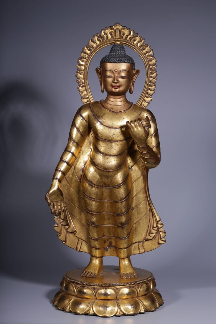 A Solemn Gilt Bronze Standing Statue of Vairocana Buddha: A Solemn Gilt Bronze Standing Statue of Vairocana Buddha,Qing Dynasty, China,Size:8.5inx21.9in,Weight:10250g 