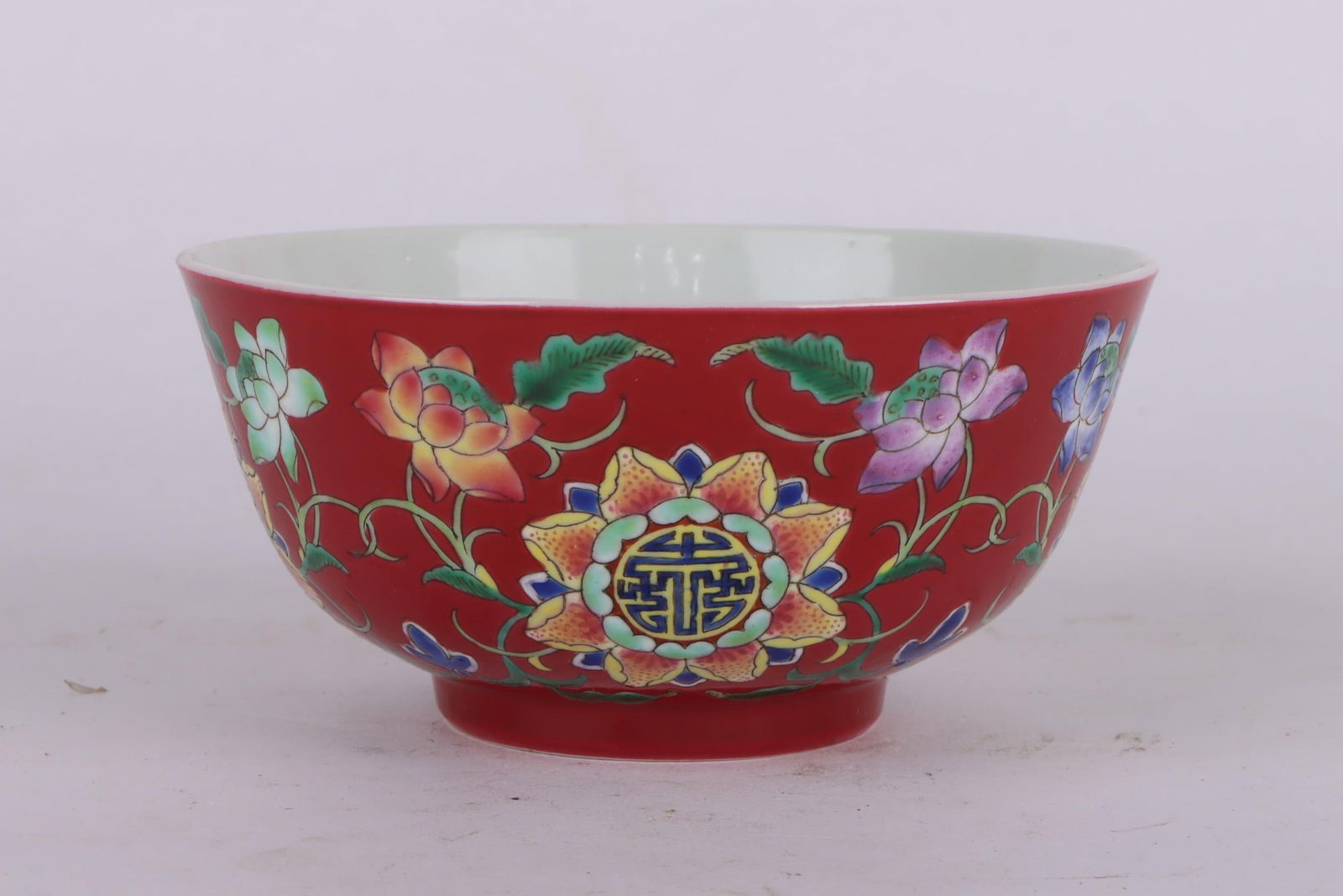 A Exquisite Famille-Rose Red Ground Flower Pattern Bowl: A Exquisite Famille-Rose Red Ground Flower Pattern Bowl,Qing Dynasty, China,Kangxi Four-character Mark,Size:2.2inx4.5in 