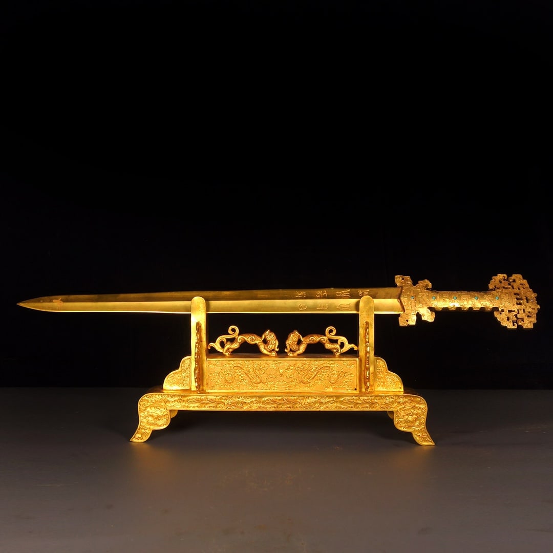 A Exquisite Bronze Gilt Gem-Inlaid Sword: A Exquisite Bronze Gilt Gem-Inlaid Sword,Han Dynasty, China,Size:9.1inx28.7inx7.9inx16.1in,Weight:1230g 铜鎏金嵌宝石剑,中国汉代