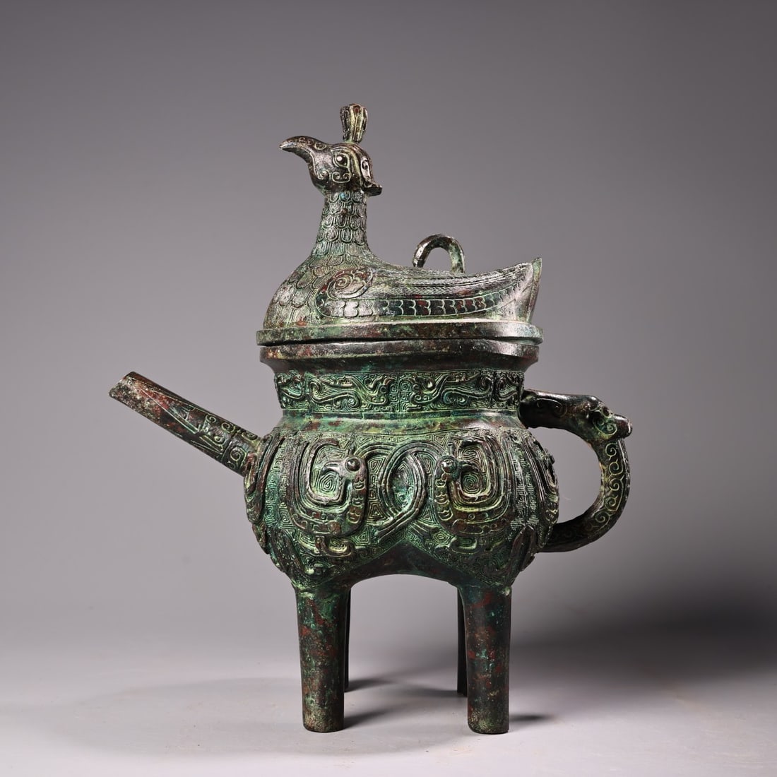 An Archaic Bronze Bird Cover Four-footed Wine Ewer (1 of 14)