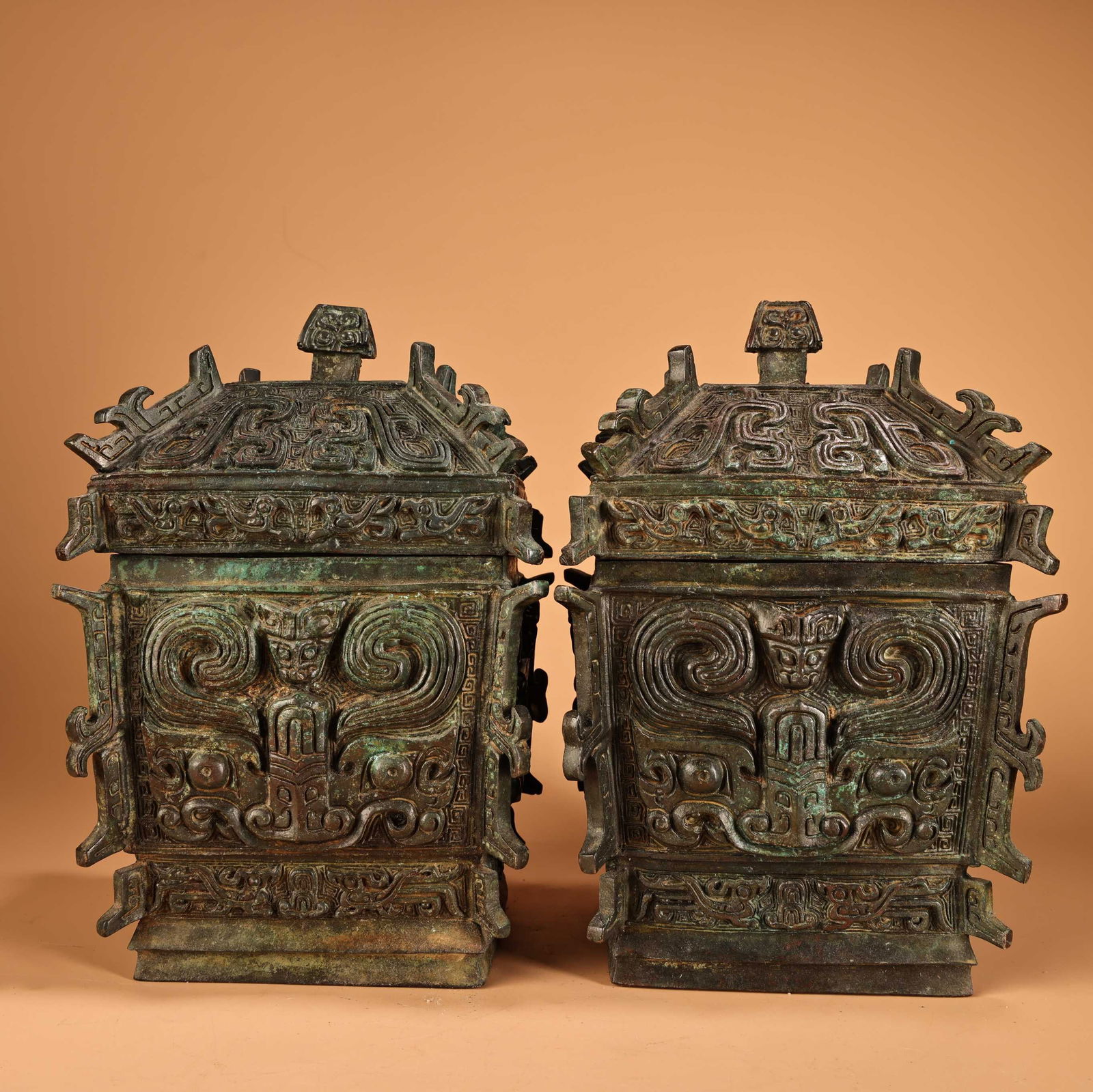 A pair of Exquisite Bronze Human Face Square Zun: A pair of Exquisite Bronze Human Face Square Zun,Han Dynasty, China,Size:8.3inx5.5in,Weight:2100g 