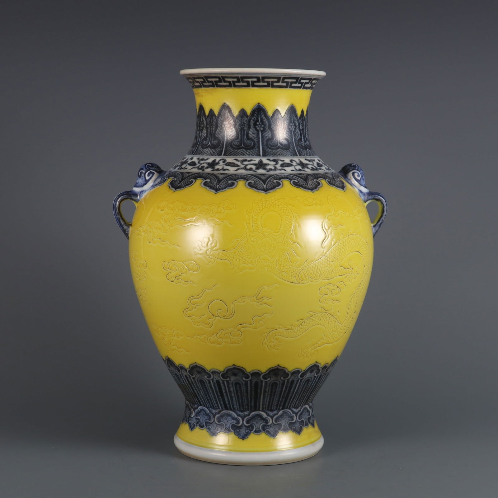 A Rare Blue and White Lemon Yellow Ground Carved Cloud and Dragon Pattern Double Ear Vase: A Rare Blue and White Lemon Yellow Ground Carved Cloud and Dragon Pattern Double Ear Vase,Qing Dynasty, China,Qianlong Six-character Mark,Size:12.5inx7.5in 