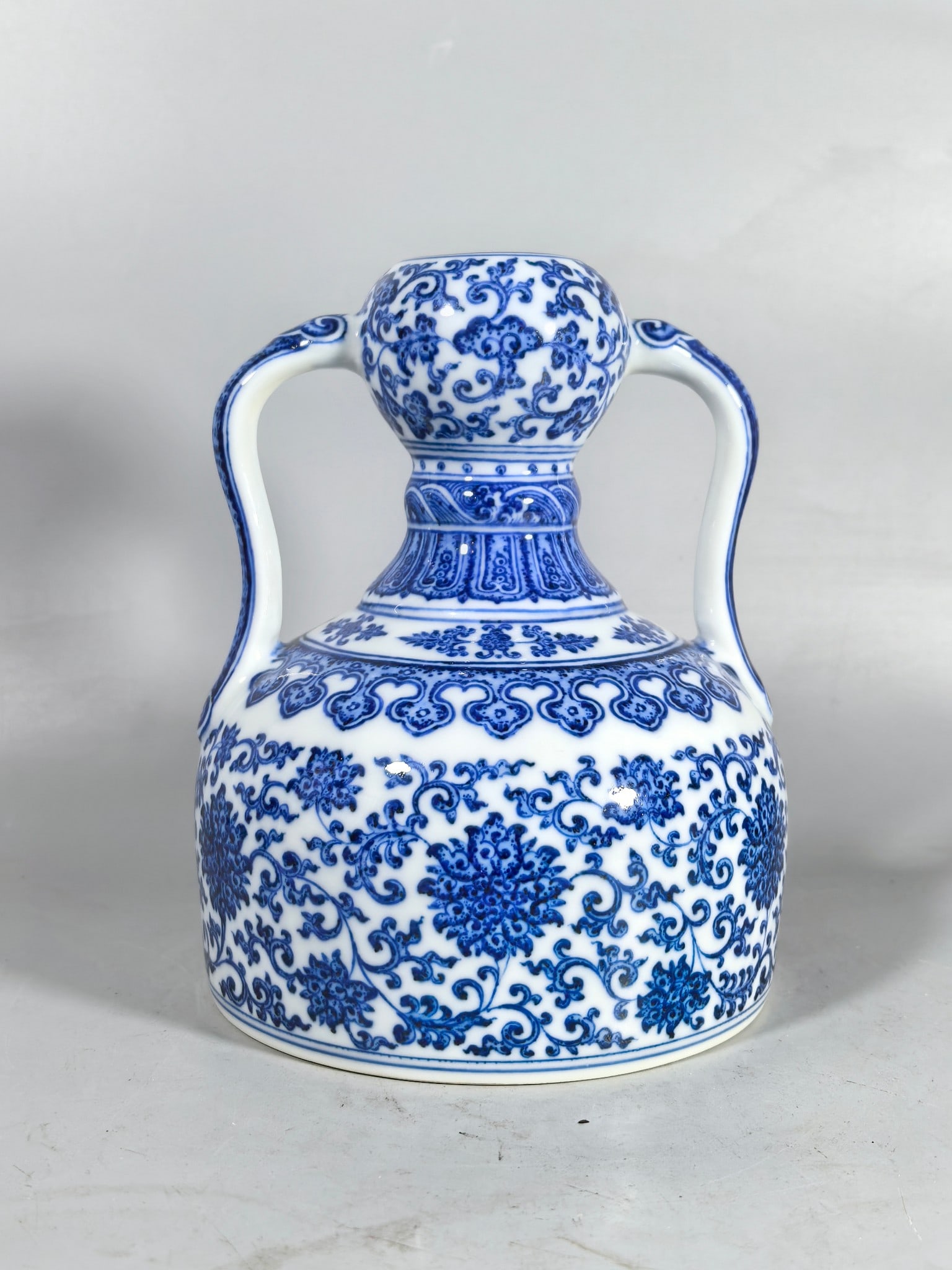A Exquisite Blue and White Lotus Pattern Double-Ears Ruyi Vase: A Exquisite Blue and White Lotus Pattern Double-Ears Ruyi Vase,Qing Dynasty, China,Qianlong Six-character Mark,Size:8inx1.4inx6.7in 