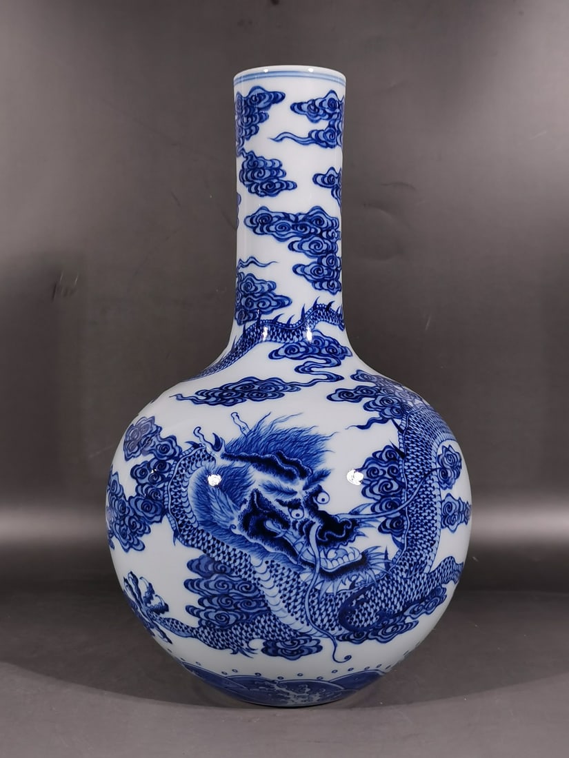 A Exquisite Blue and White Dragon Pattern Vase: A Exquisite Blue and White Dragon Pattern Vase,Qing Dynasty,China,Qianlong Six-character Mark,Size:14.4inx2.6inx8.7in 青花龙纹天球瓶,中国清&