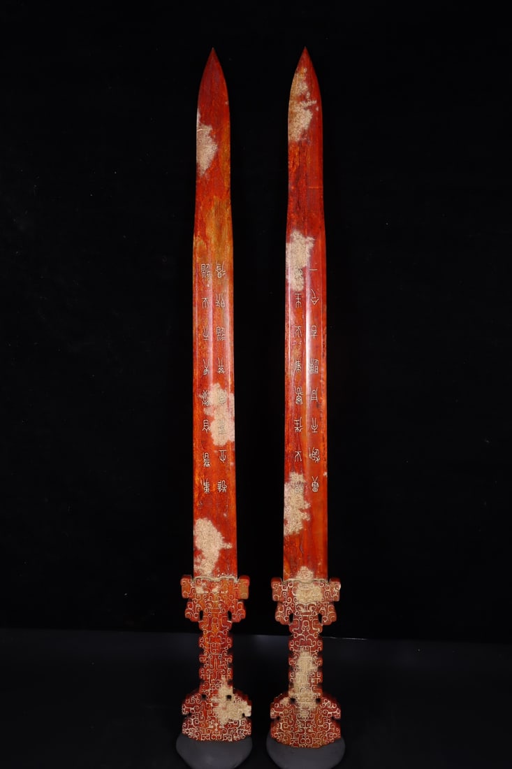 A pair of Exquisite Hetian Jade Sword: A pair of Exquisite Hetian Jade Sword,Han Dynasty, China,Size:27.4inx3inx0.6in,Weight:664g 一对和田玉剑,中国汉代
