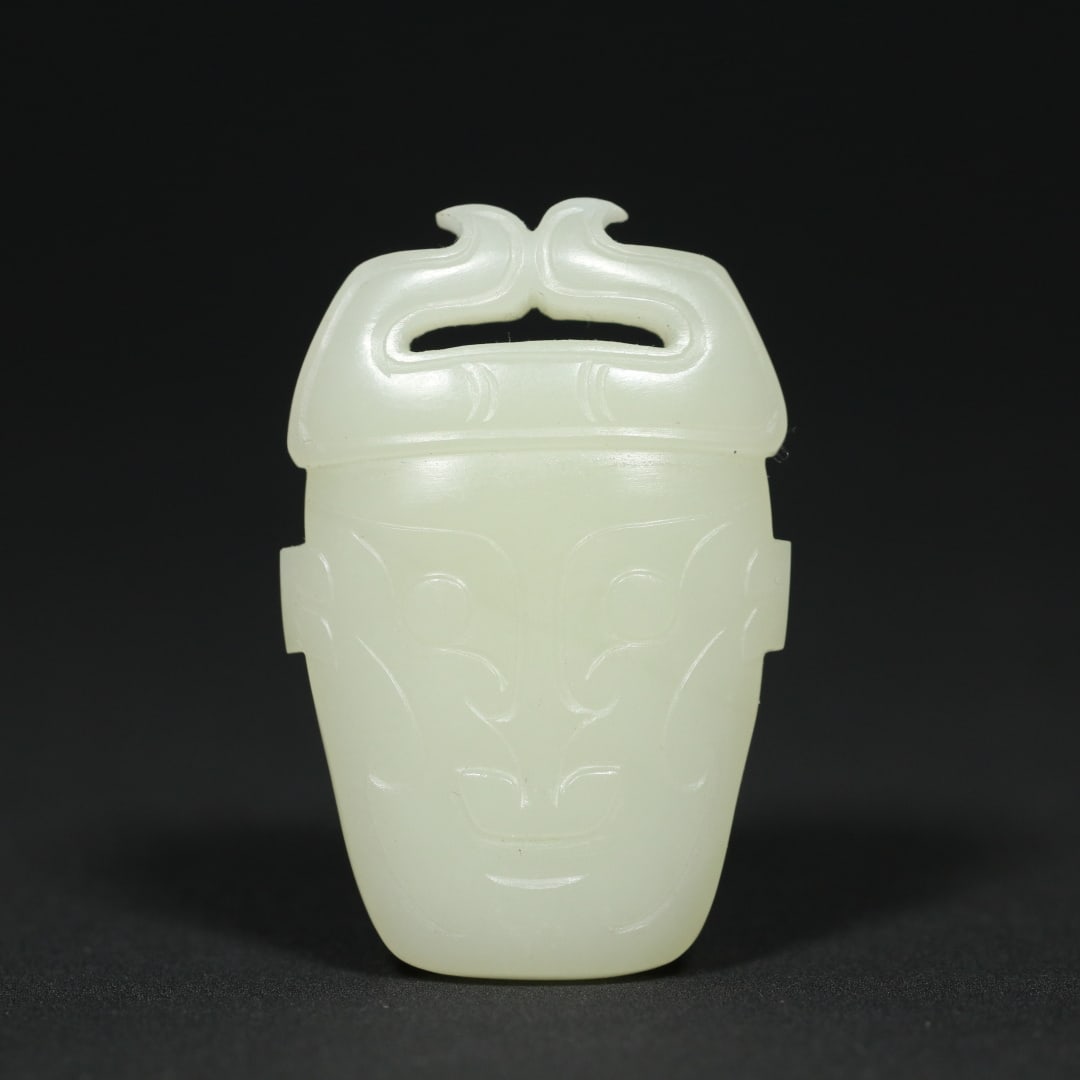An Exquisite White Jade Human-face Pattern Pendant: An Exquisite White Jade Human-face Pattern Pendant Han Dynasty, China Size:2.2inx1.4inx0.4in Weight:34.6g白玉人面纹挂件 中国汉代 Size: