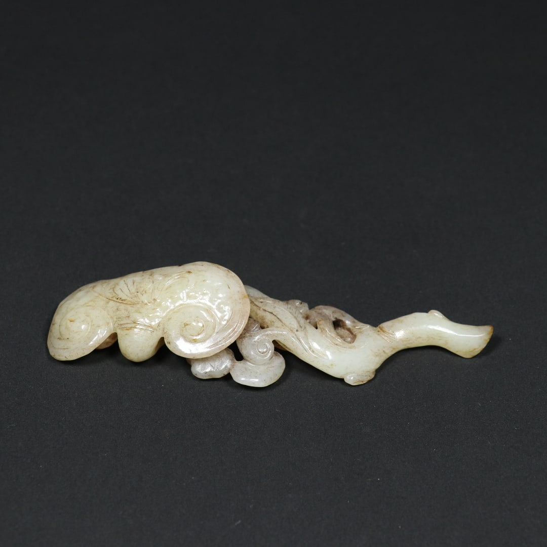 An Exquisite White Jade Ganoderma lucidum Pattern Ruyi Ornament: An Exquisite White Jade Ganoderma lucidum Pattern Ruyi Ornament Qing Dynasty, China Size:5.4inx1.5inx0.9in Weight:74.2g白玉如意摆件