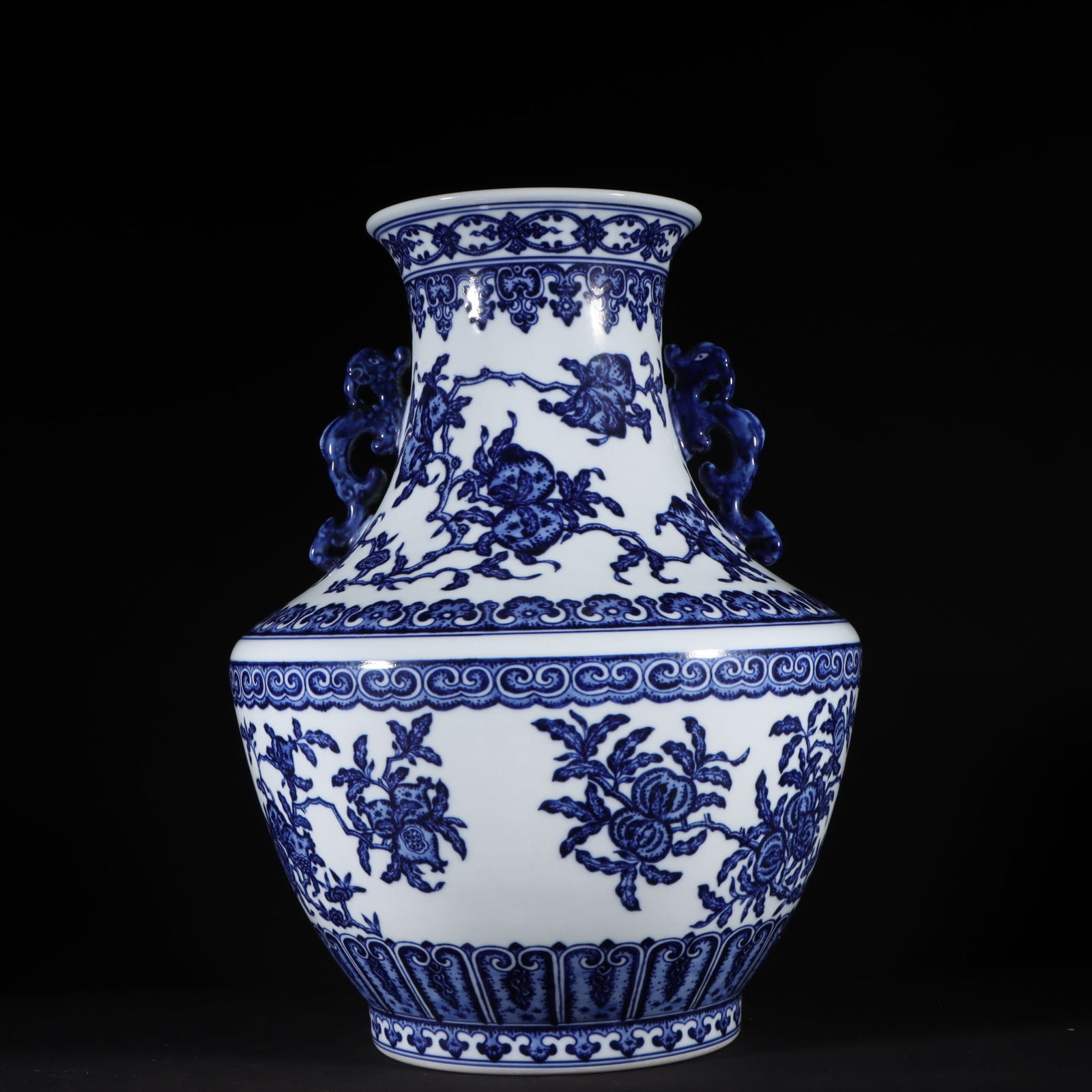 An Exquisite Blue and White Flower and Fruit Pattern Double-Ears Vase: An Exquisite Blue and White Flower and Fruit Pattern Double-Ears Vase Qing Dynasty, China Qianlong Six-character Mark Size:13.8inx10.4in青花三多纹螭龙耳