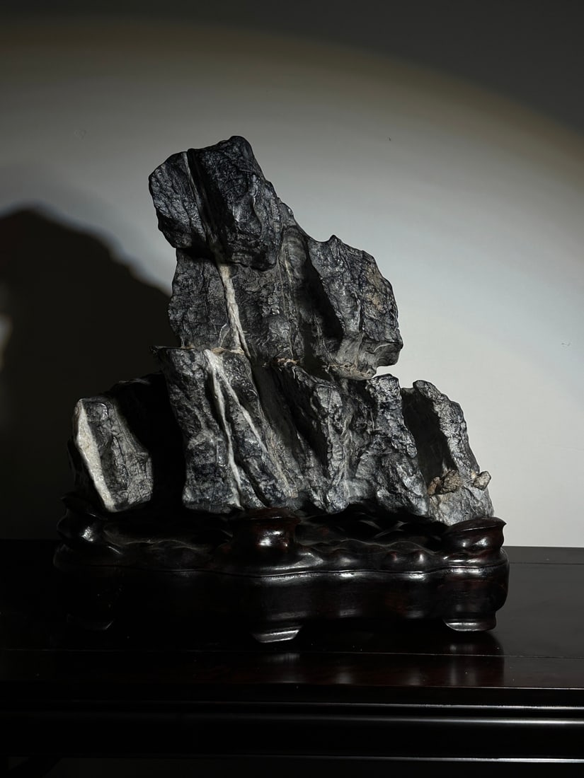 An Exquisite Lingbi Stone Rockery Ornament: An Exquisite Lingbi Stone Rockery Ornament Qing Dynasty, China Size:20.5inx18.9inx10.6in灵璧石山摆件 中国清代 Size:52cmx48cmx27cm