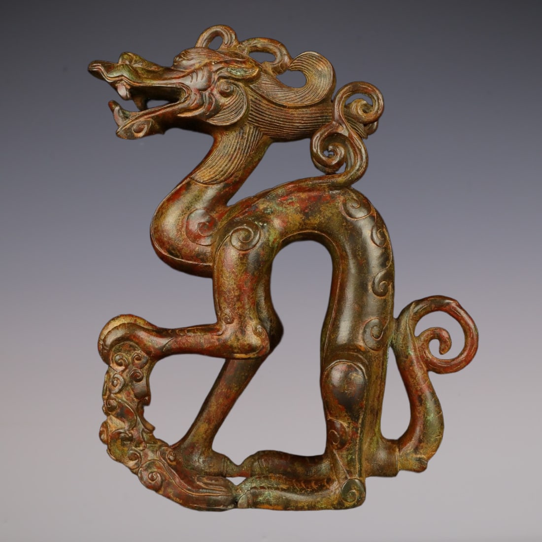 An Exquisite Bronze Dragon Ornament: An Exquisite Bronze Dragon Ornament Han Dynasty, China Size:10.6inx12.6in Weight:4350g青铜龙尊 中国汉代 Size:27cmx32cm Weight:4350g