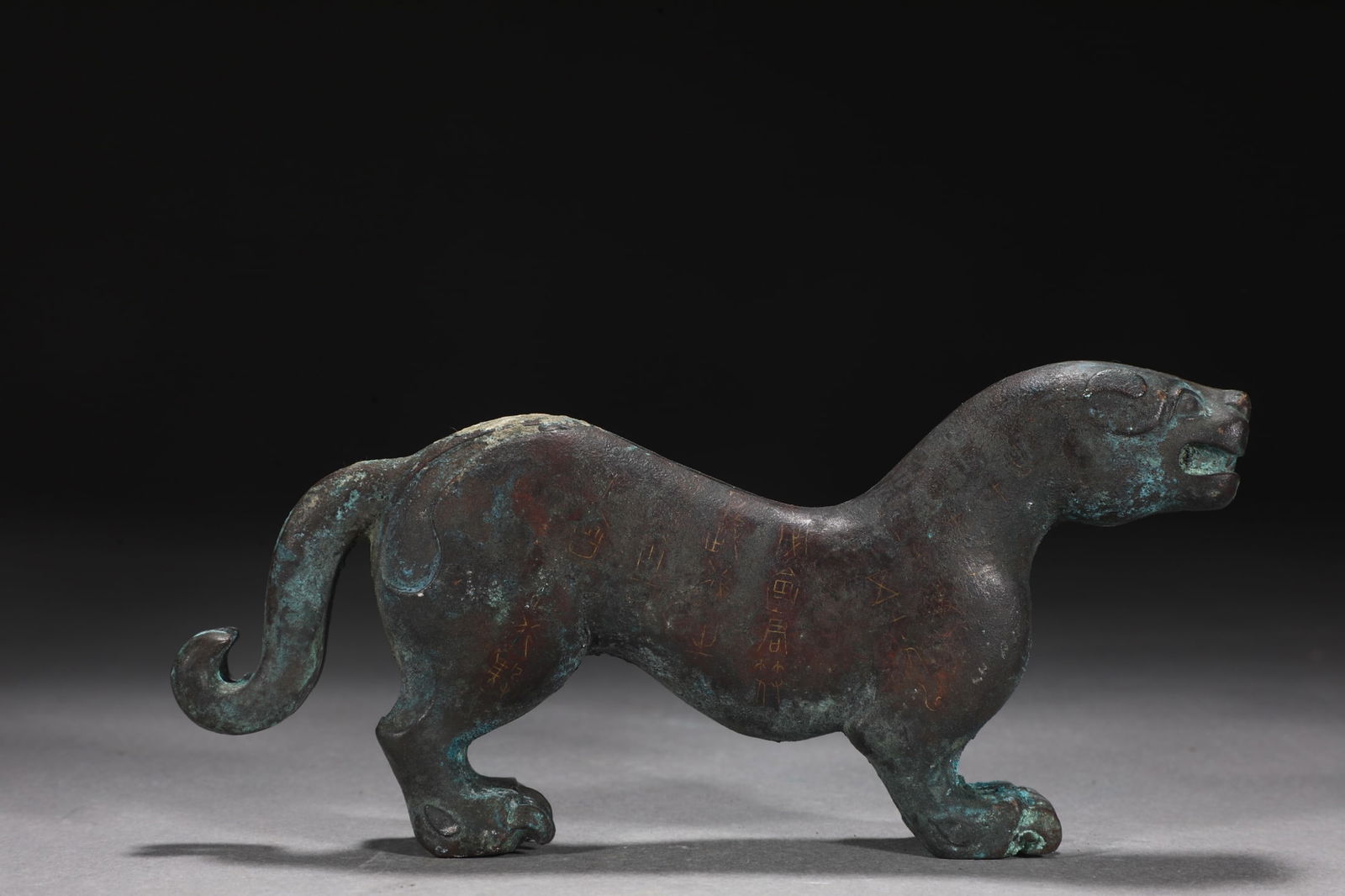 An Exquisite Bronze Inlaid Silver With Inscription Tiger-Shaped Ornament (1 of 9)