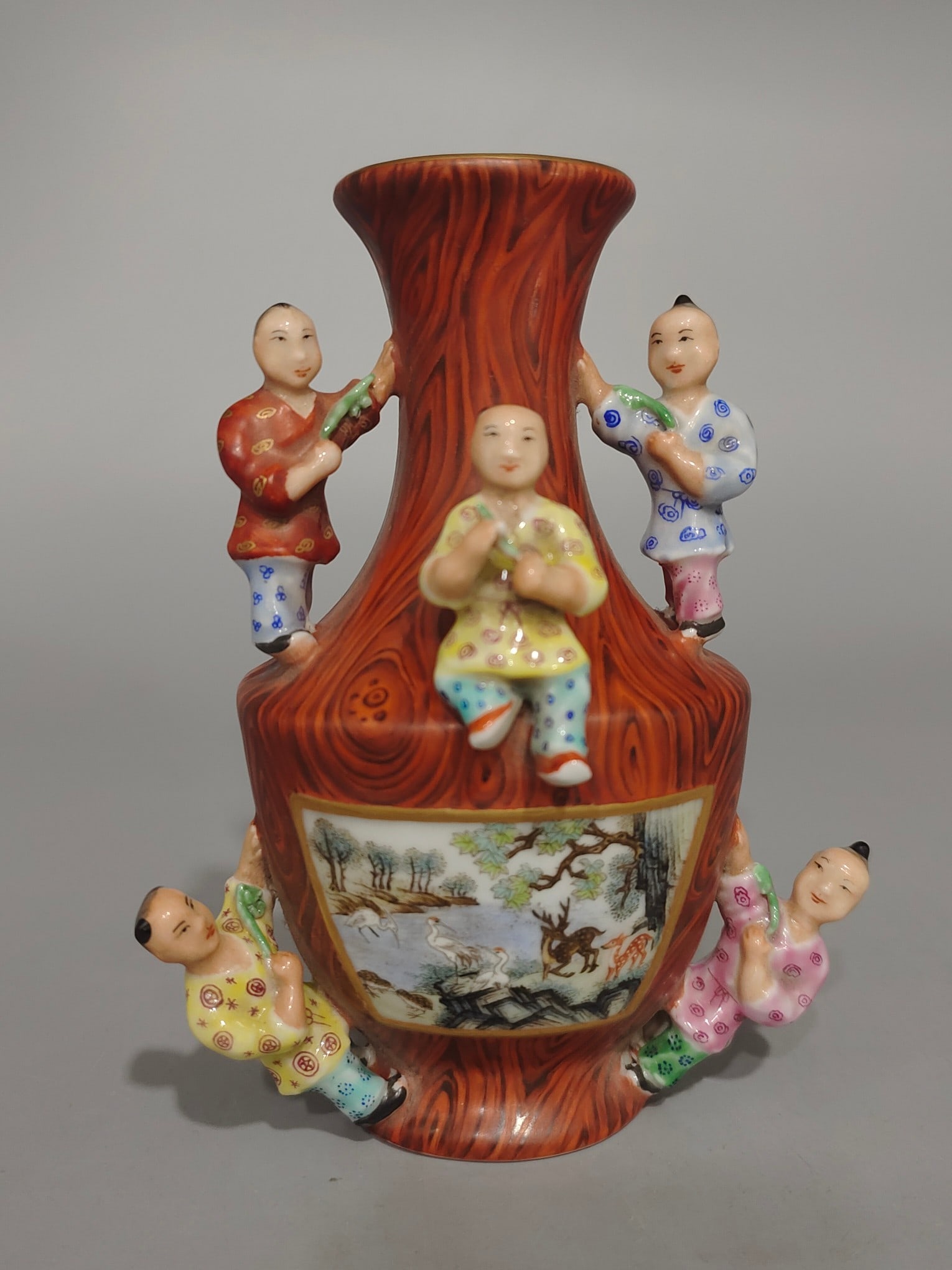 An Exquisite Imitation Wood Grain Glazed Animal Pattern Figure Pattern Vase: An Exquisite Imitation Wood Grain Glazed Animal Pattern Figure Pattern Vase Qing Dynasty, China Qianlong Six-character Mark