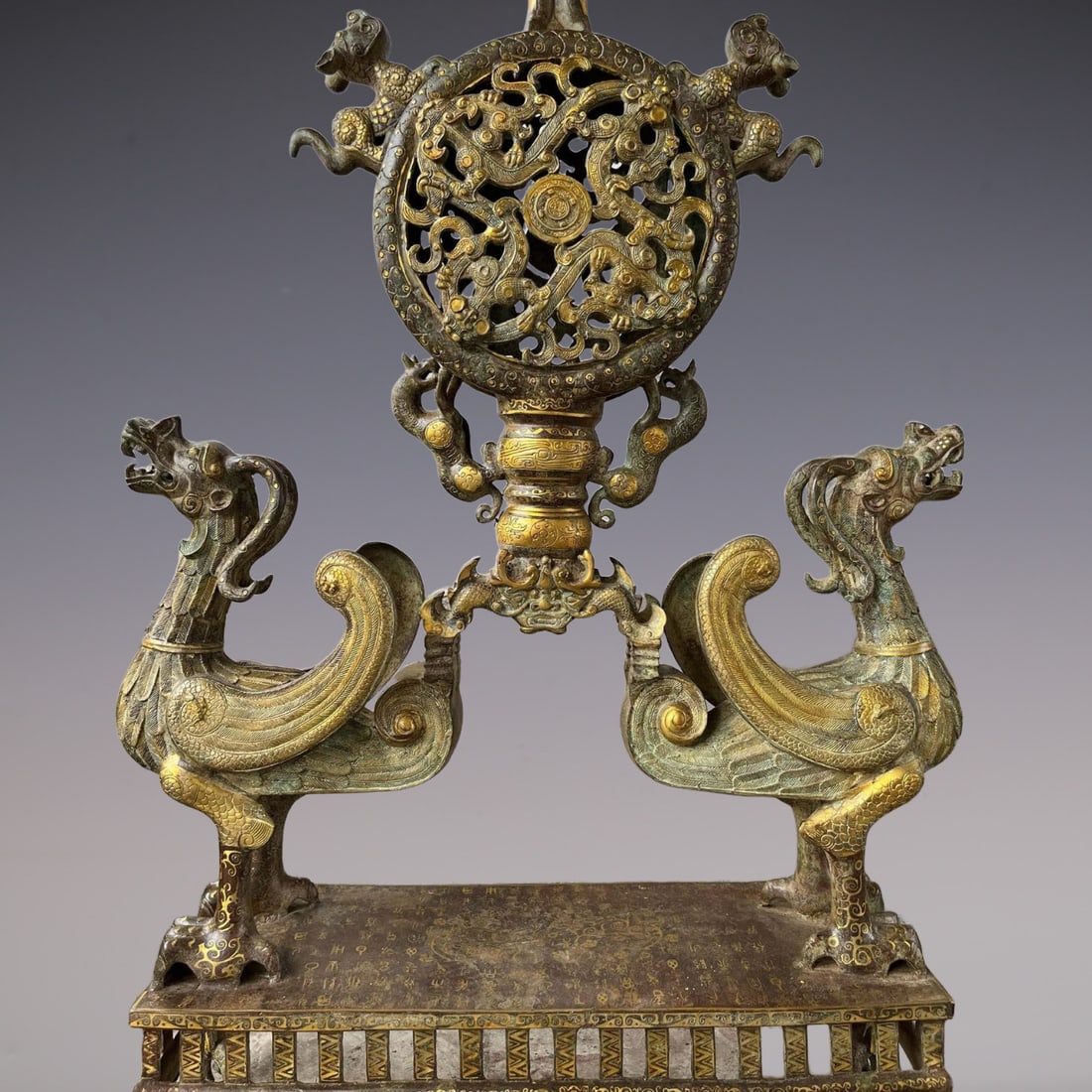 An Exquisite Bronze Inlaid Gold Auspicious Beast Pattern With Inscription Ornament: An Exquisite Bronze Inlaid Gold Auspicious Beast Pattern With Inscription Ornament Han Dynasty, China Size:29.5inx47.6in Weight:30500g青铜错金凤鸟透花&#