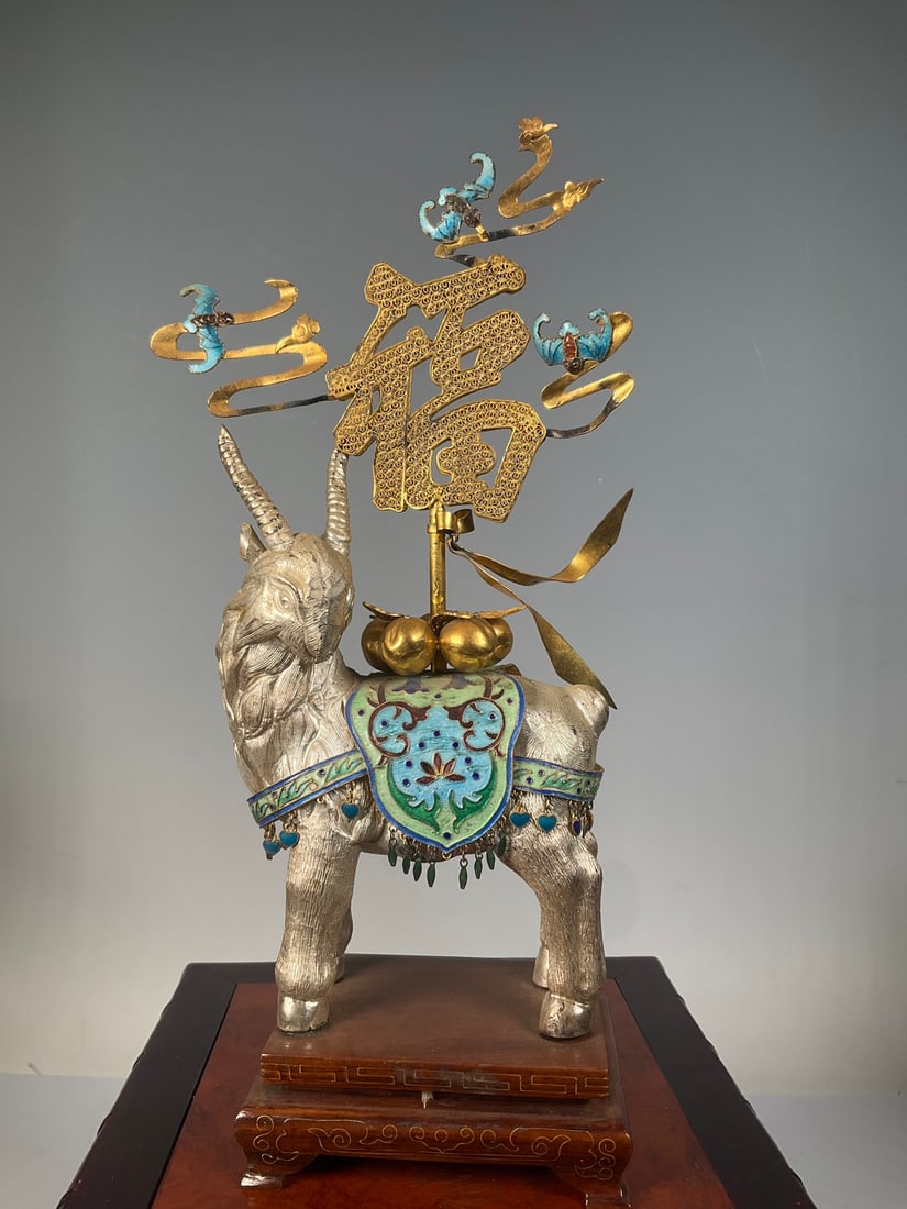 An Exquisite Silver Bats and Peach Pattern Sheep Ornament: An Exquisite Silver Bats and Peach Pattern Sheep Ornament Qing Dynasty, China Size:10.2inx5.5in Weight:365g银烧蓝洋洋得意摆件 中国