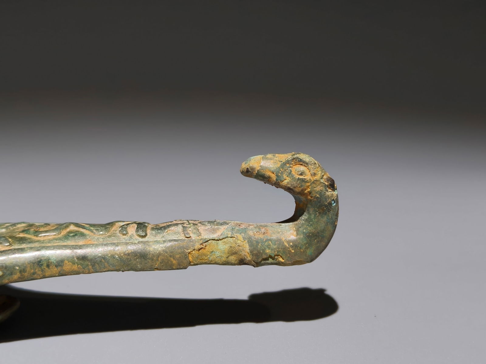 An Archaic Bronze Snake Pattern Hook - 7