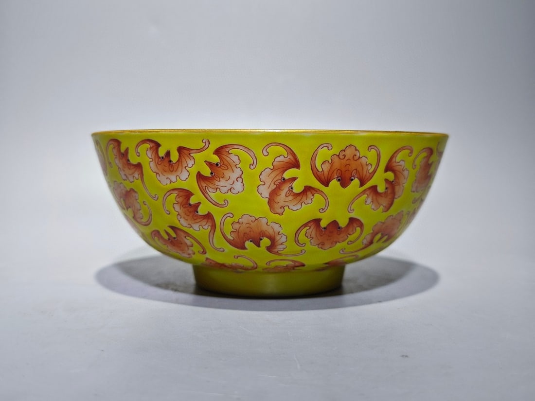 An Exquisite Iron-Red Yellow Ground Painted Gold Bats Pattern Bowl: An Exquisite Iron-Red Yellow Ground Painted Gold Bats Pattern Bowl,Qing Dynasty,China,Tongzhi Four-character Mark,Size:2.6inx6.1in 矾红釉黄地描金蝙Ś