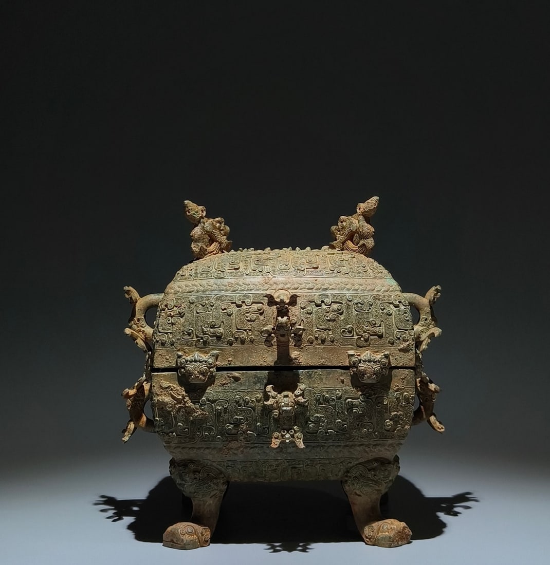 An Archaic Bronze Hollow Chi-Dragon Pattern Four Legs Food Vessel,With Inscription: An Archaic Bronze Hollow Chi-Dragon Pattern Four Legs Food Vessel,With Inscription,the Warring States period in China,Size:10.2inx10.2inx7.9in 