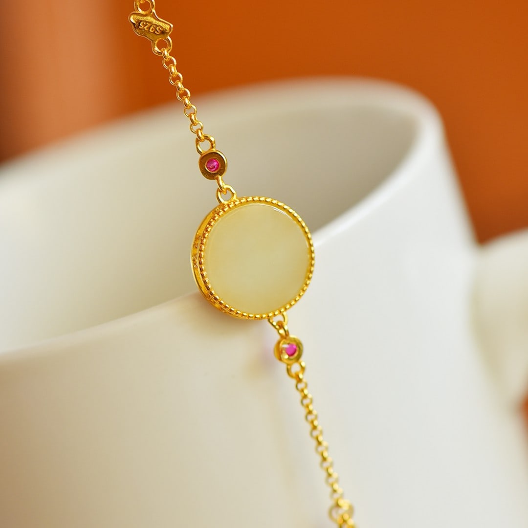 An Exquisite Sterling Silver-Gold Plated Inlaid White Jade Bracelet: An Exquisite Sterling Silver-Gold Plated Inlaid White Jade Bracelet,Size:12mmx12mm 纯银镀金镶白玉手链