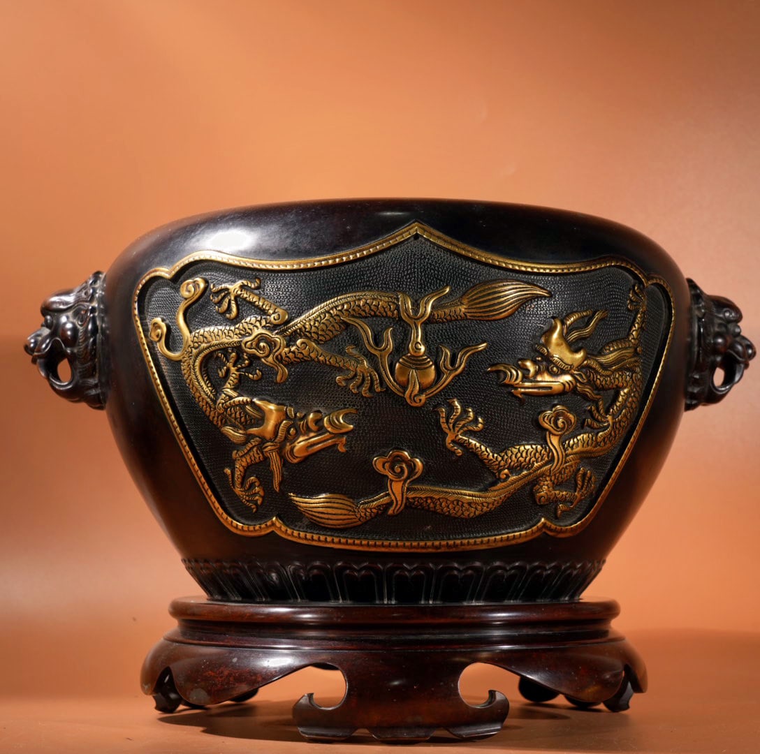 An Exquisite Gilt Bronze Dragon Pattern Lion-Ears Tripod Censer,With Base: An Exquisite Gilt Bronze Dragon Pattern Lion-Ears Tripod Censer,With Base,Ming Dynasty, China,Xunde Six-character Mark,Size:9.1inx5.9in,Weight:14515g 