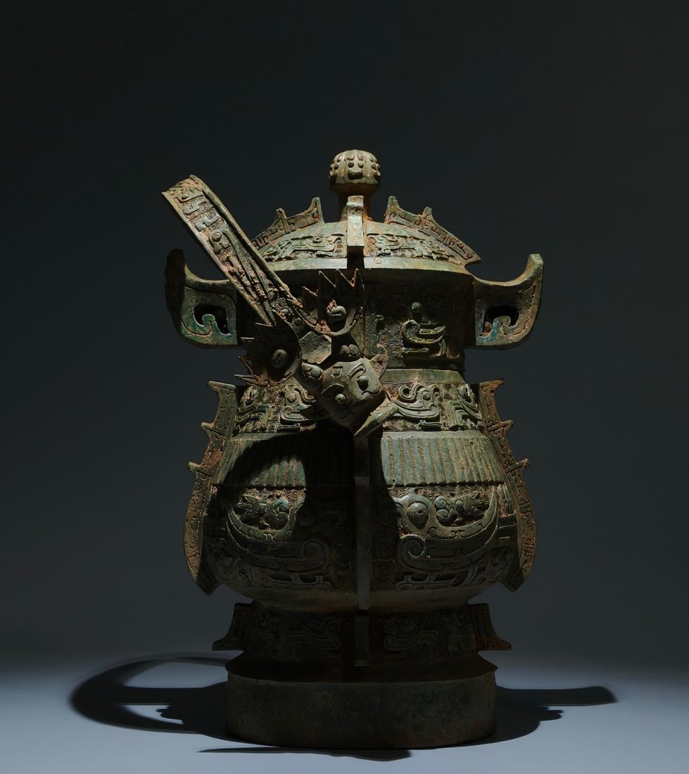 An Archaic Bronze Phoenix Pattern Beast-Ears Ewer: An Archaic Bronze Phoenix Pattern Beast-Ears Ewer,W.Zhou , China,Size:17.7inx11inx11in 青铜凤纹兽耳提壶,中国西周时期