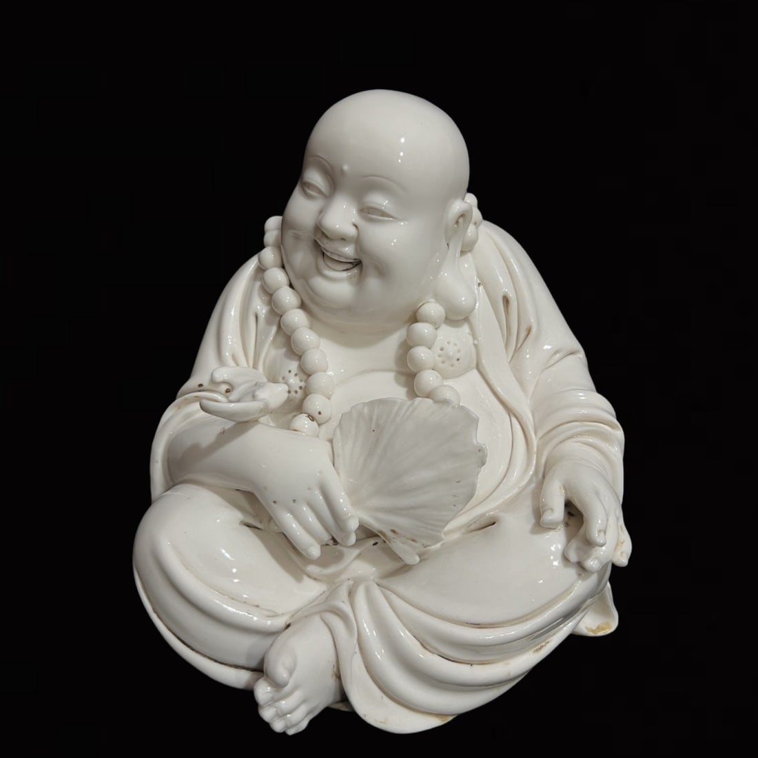 A Solemn Blance-De-Chine Statue of Maitreya Buddha (1 of 9)